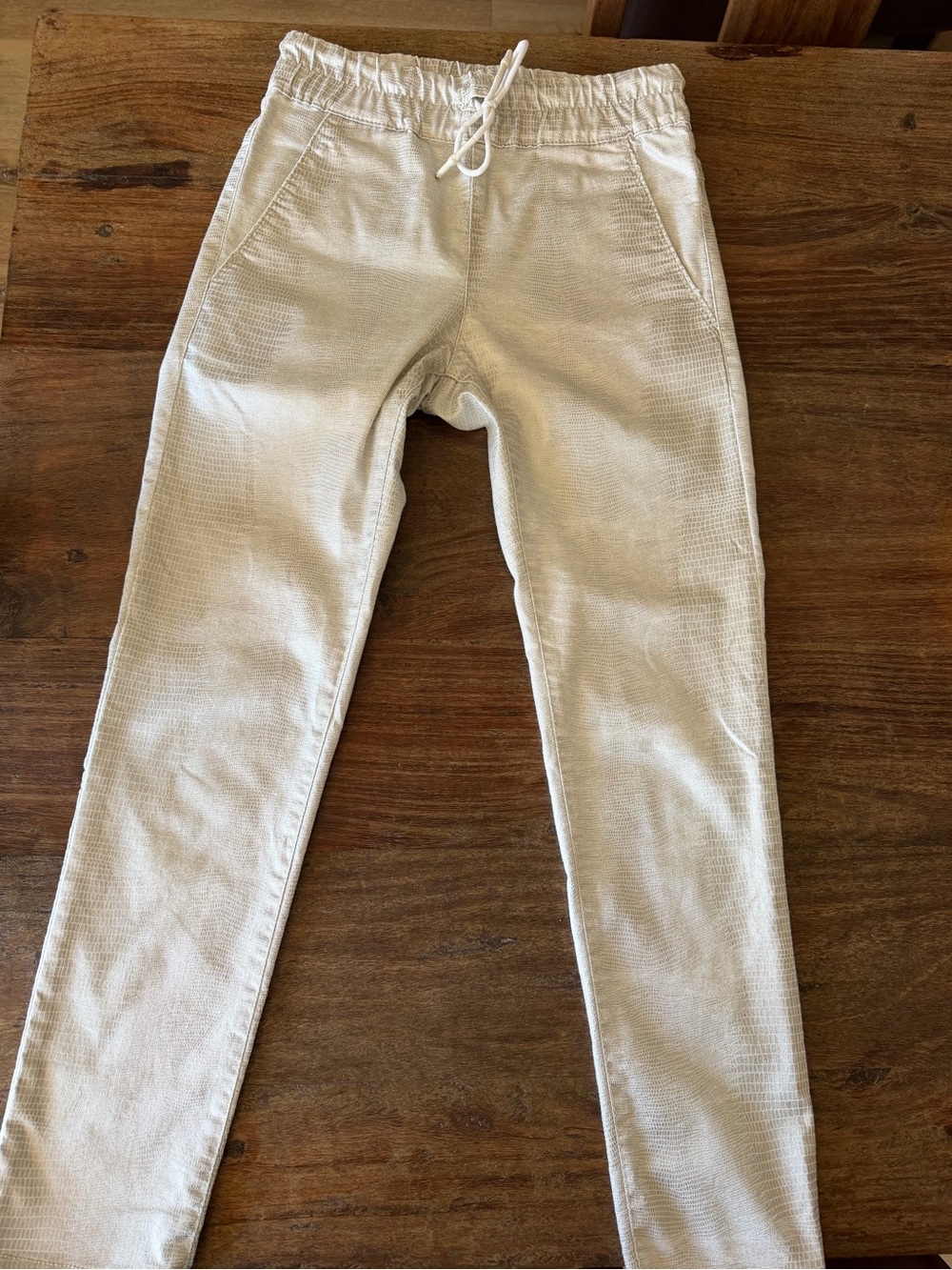 Flog joggers with a silver sheen snake like print